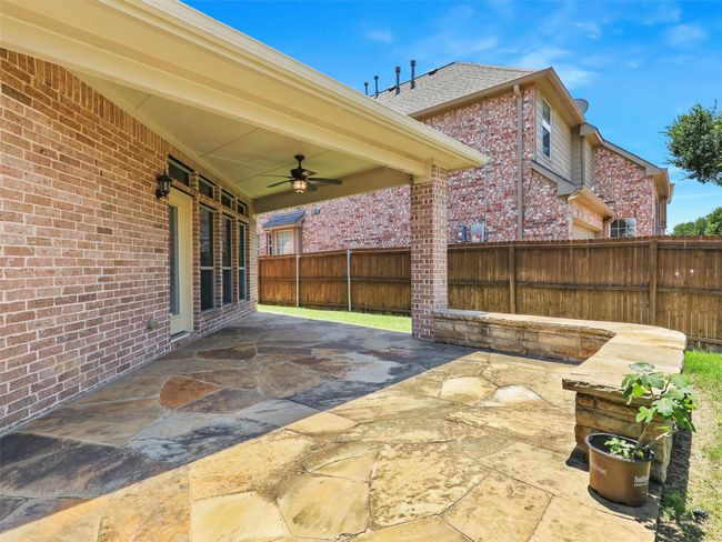 Fenced backyard featuring ceiling fan and a patio | Image 35