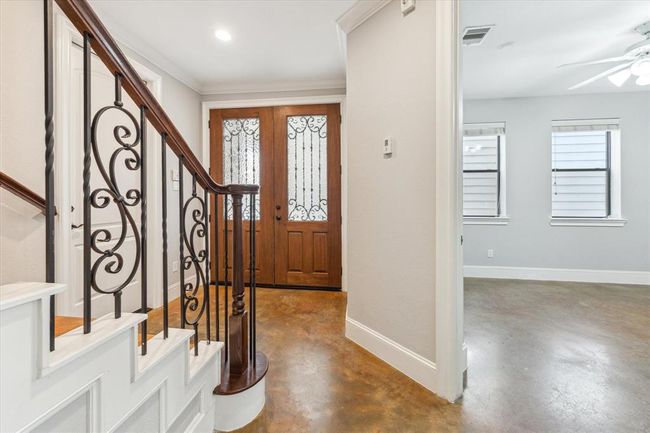Additional view of the entry as it leads to one of two secondary bedrooms on the first floor. | Image 7