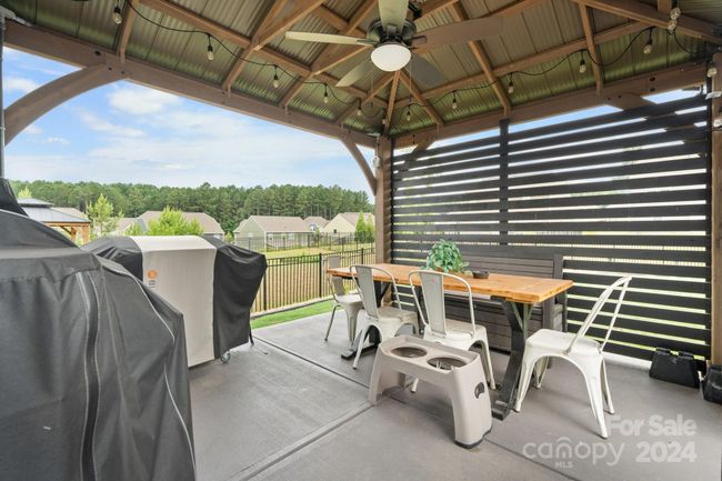 Gazebo has privacy siding, lights & fan. Perfect place for your outdoor cooking & entertaining! | Image 37
