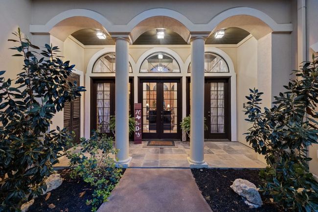 Doorway to property with stucco siding and french doors | Image 5