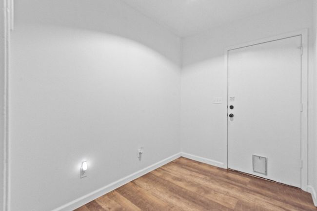 Empty room with hardwood / wood-style flooring | Image 29