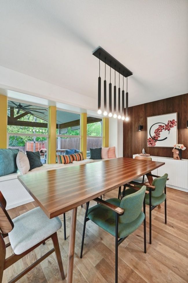 A unique statement chandelier illuminates your dining table setting the atmosphere for enjoying home cooked meals. | Image 17