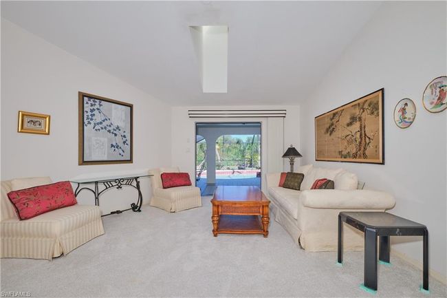 Formal Living Room with Pocket Sliding Glass Doors to the Lanai/Pool. | Image 10
