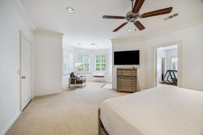 View of the sitting area across from primary bedroom. Lots of natural light flows into this room through the oversized windows. | Image 18