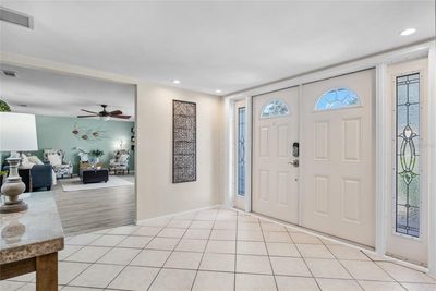 A generously sized Foyer invites you into the home through striking double doors. | Image 3