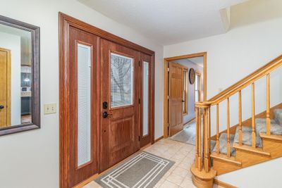 Spacious entryway with adjacent living room | Image 2