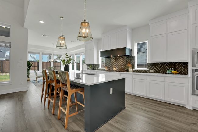 Kitchen featuring tasteful backsplash, oven, and light wood-style flooring | Image 9