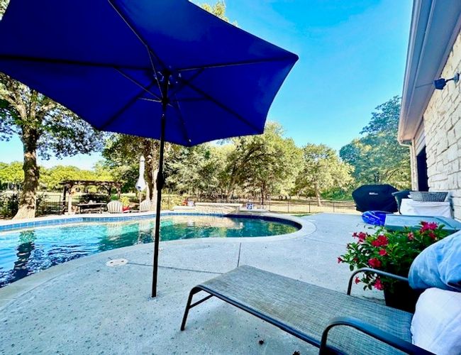 View of pool with a patio area | Image 37