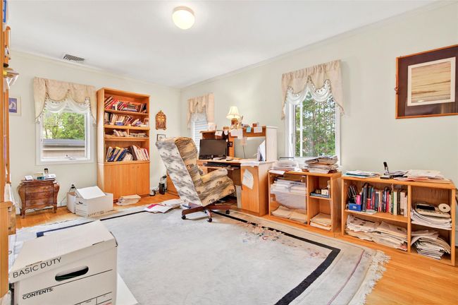 Office space featuring ornamental molding and wood finished floors | Image 39