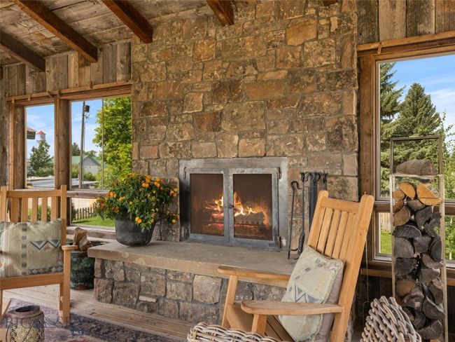 Wood burning fireplace in outdoor living room | Image 22