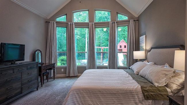 Oversized primary bedroom enjoys sunrise views | Image 13