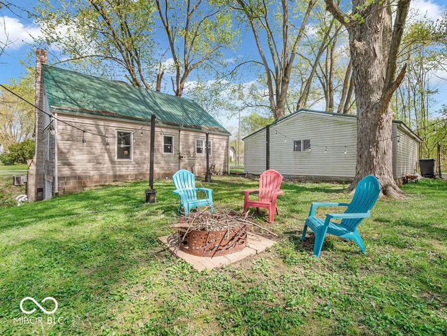view of yard featuring a fire pit | Image 26