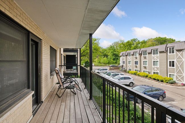 Relax on your spacious private balcony—perfect for morning coffee, evening unwinding, or taking in the vibrant energy of this lakeside neighborhood just blocks from the Chain of Lakes and Greenway trails. | Image 27