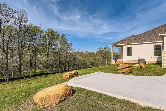 View of yard with central AC unit and a patio | Image 27