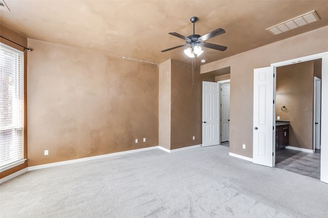Unfurnished bedroom with multiple windows, visible vents, and carpet floors | Image 21