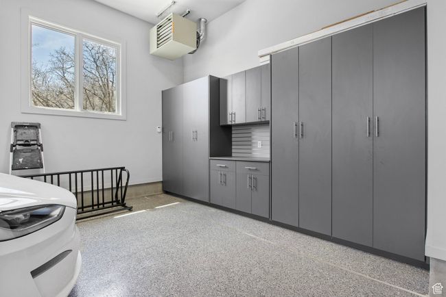 Kitchen featuring light speckled floor and gray cabinetry | Image 127