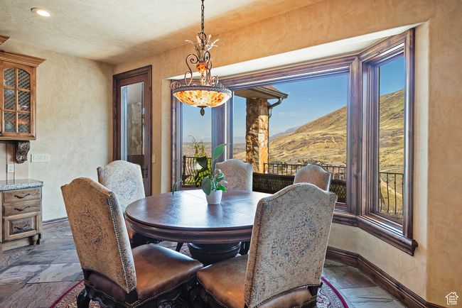 Dining space featuring recessed lighting, baseboards, a mountain view, and stone tile flooring | Image 20
