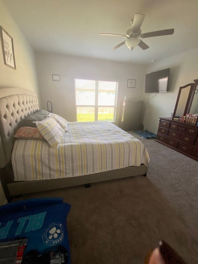 Bedroom with carpet flooring and ceiling fan | Image 16