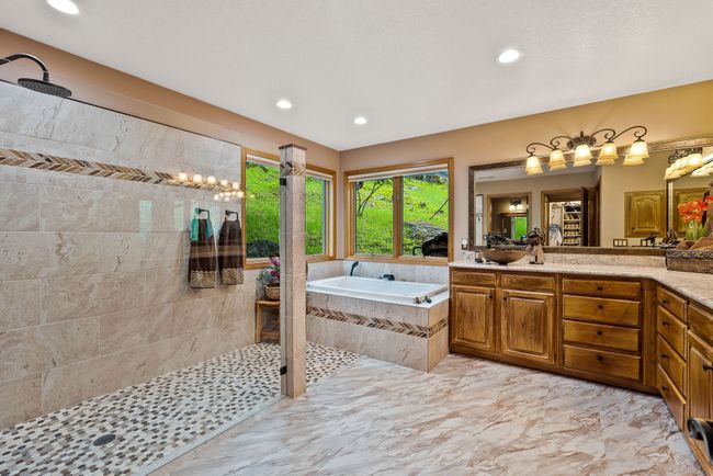 Primary Bath - full bathroom with new custom shower, in-floor heat, LVP flooring, granite countertops | Image 32