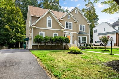 Front of property with a garage and a front yard | Image 3