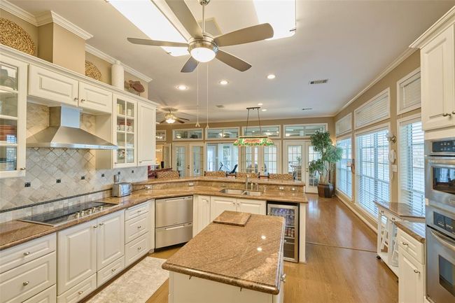 Beautiful custom cabinets + trash drawer | Image 20