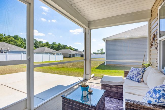 Sunroom featuring outdoor lounge area | Image 19