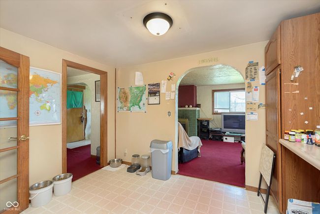 hall with baseboards, arched walkways, and light floors | Image 15