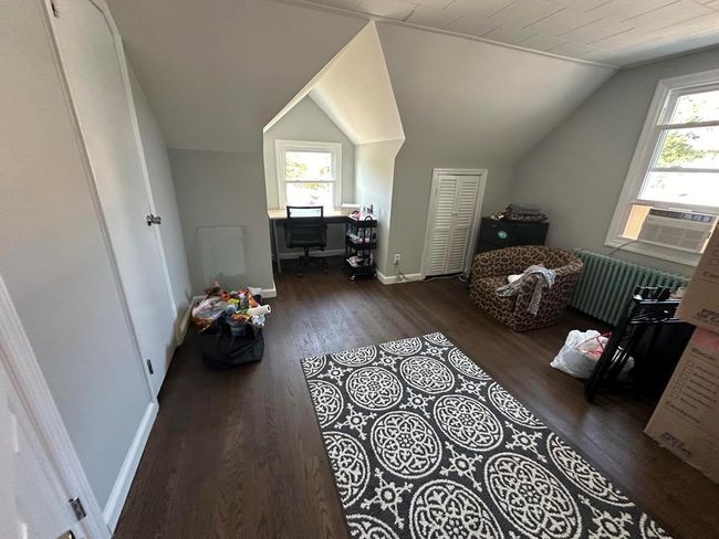 Bonus room with radiator, vaulted ceiling, wood finished floors, and plenty of natural light | Image 10