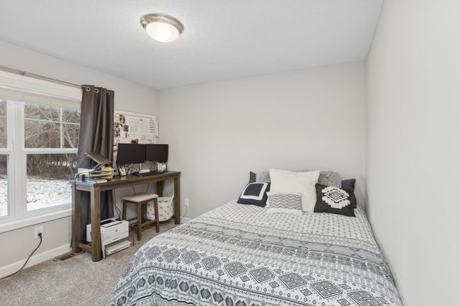 One of three additional secondary bedrooms on the upper level. | Image 16