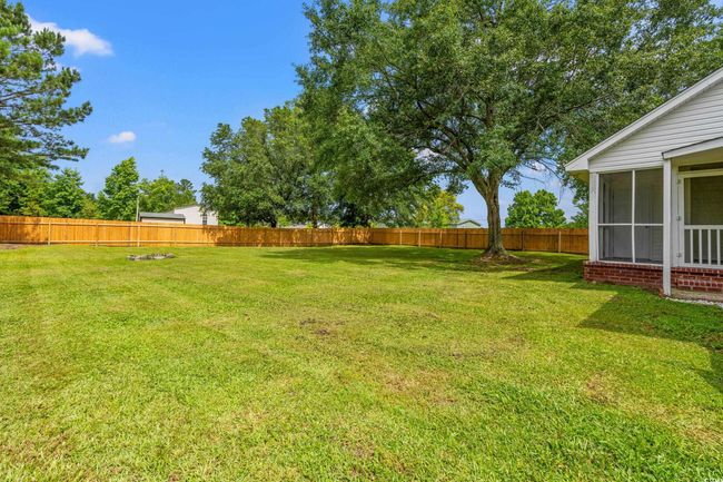 Fenced backyard with a sunroom | Image 31