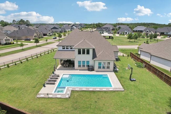 View of pool featuring a residential view, a fenced backyard, and a patio | Image 33