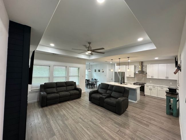 Carpeted bedroom featuring ceiling fan and recessed lighting | Image 17