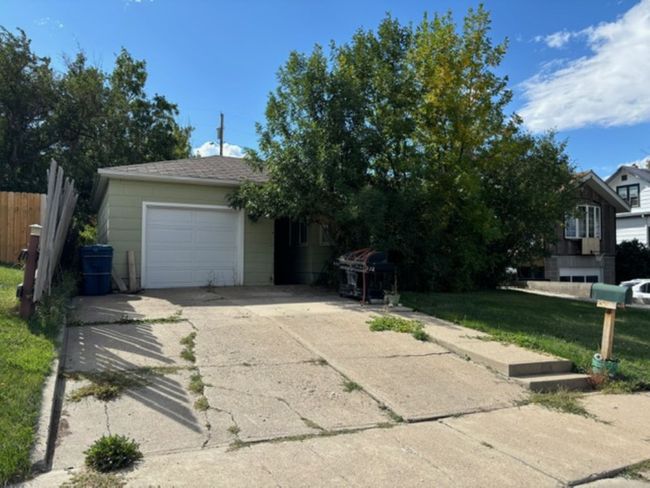 View of front of house with a garage and a front yard | Image 6