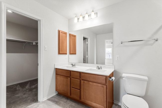 Primary bathroom with dual vanity and walk-in shower | Image 20