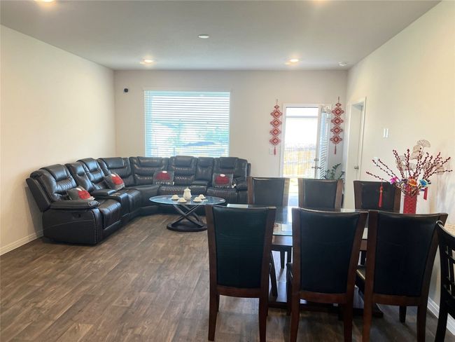 Living room featuring plenty of natural light, dark wood-style floors, recessed lighting, and baseboards | Image 10