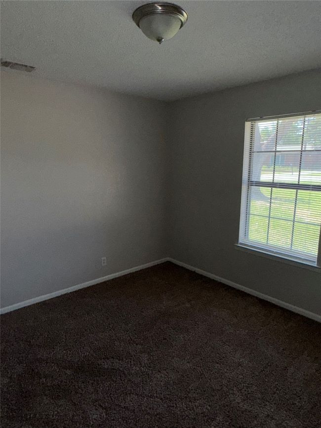 Carpeted spare room featuring baseboards | Image 9