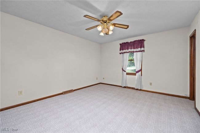 Carpeted Primary BR with ceiling fan | Image 18
