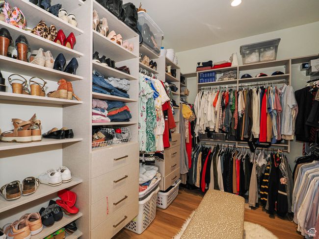 Walk in closet featuring wood finished floors | Image 55
