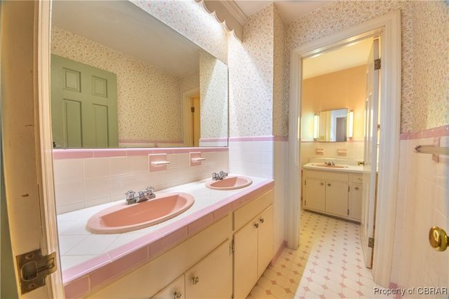 Bathroom featuring vanity and tile walls | Image 25