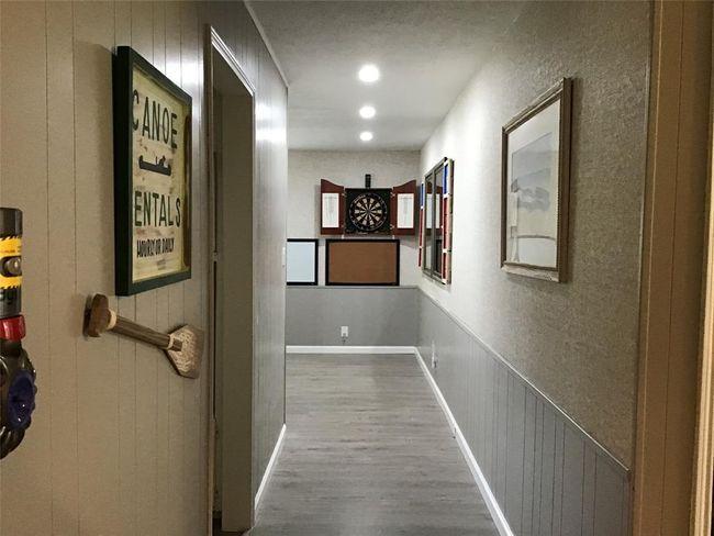 Hall that flows back to the kitchen dining area has generous closet for storage. | Image 37