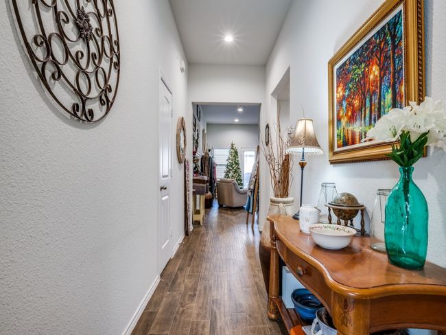 Hall with wood finished floors and recessed lighting | Image 4