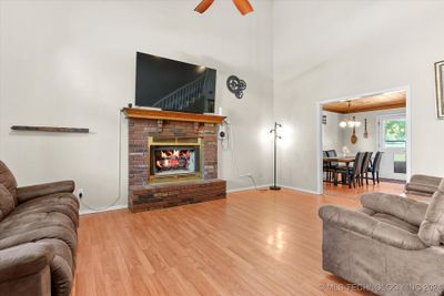 Step into the spacious living room w/ fireplace. | Image 3