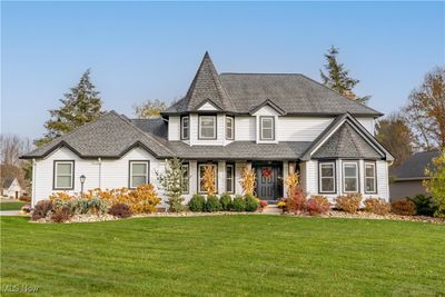 CURB APPEAL GALORE!! New siding, gutters, lighting, trim, exterior doors and more! | Image 1