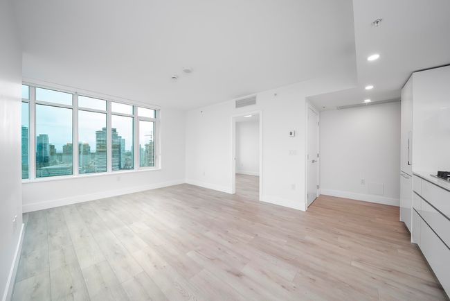 Unfurnished living room featuring baseboards, visible vents, recessed lighting, and light wood-type flooring | Image 7