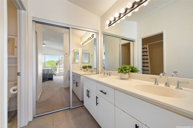 Primary en suite bathroom with double vanities and lots of light. Separate from shower and toilet. | Image 21