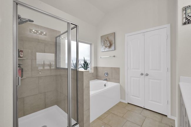 No compromises in this bathroom! Enjoy a roomy shower, soaking tub, and a double door entrance into the walk-in closet. | Image 18