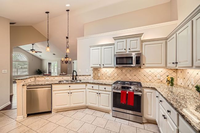 Modern Stainless Steel Appliances in large and open kitchen | Image 7