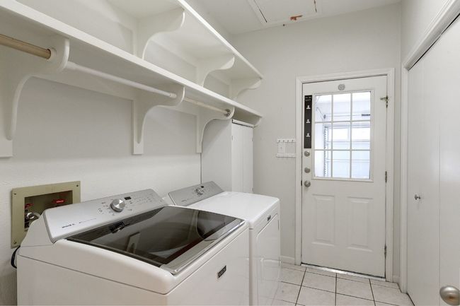 Laundry room in unit. | Image 24
