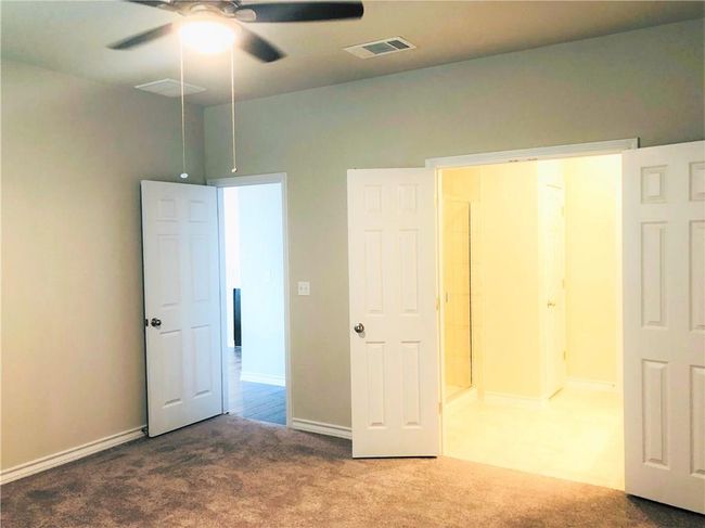 Unfurnished bedroom featuring carpet floors and ceiling fan | Image 14