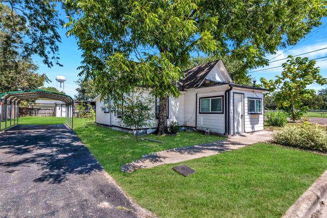View of front of home with a detached carport and driveway | Image 6